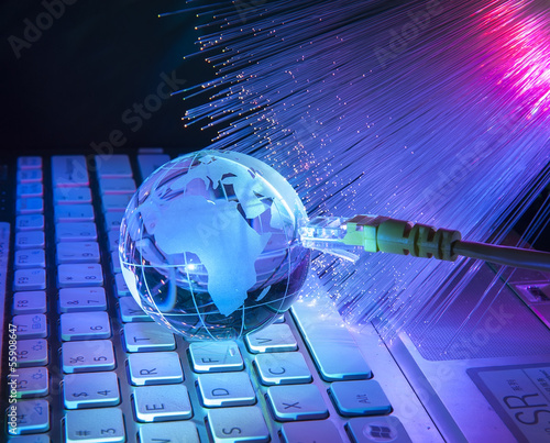 Photo: world map technology style against fiber optic background world map technology style against fiber optic background