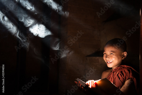 Photo: Asian little monk reading book Asian little monk reading book