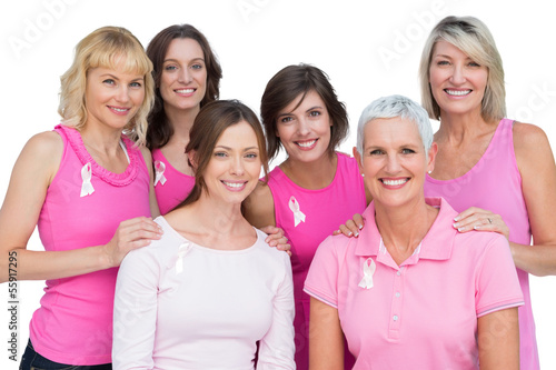Photo: Smiling women posing and wearing pink for breast cancer Smiling women posing and wearing pink for breast cancer