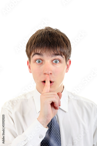 Photo: Teenager with Finger on his Lips Teenager with Finger on his Lips
