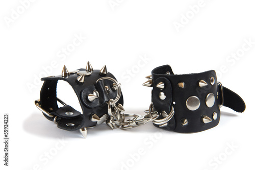 Photo: black leather handcuffs isolated black leather handcuffs isolated
