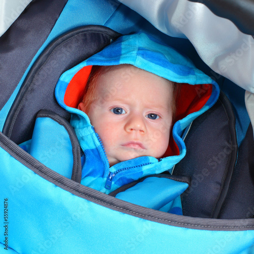 Photo: Little boy dressed in warm clothes for cold weather. Little boy dressed in warm clothes for cold weather.