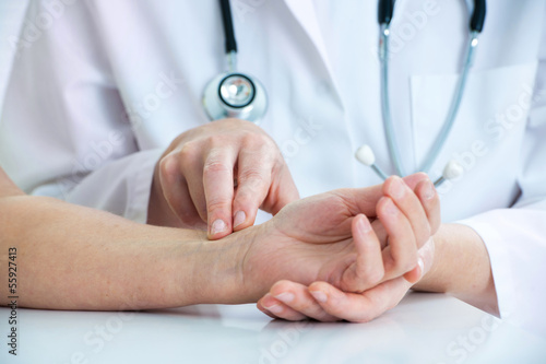 Photo: Measuring of pulse on wrist Measuring of pulse on wrist
