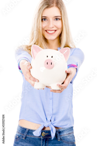 Photo: Beautiful woman holding a piggy bank Beautiful woman holding a piggy bank