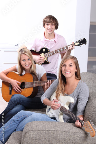 Photo: Teen playing guitar Teen playing guitar