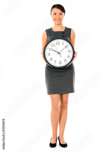 Photo: Business woman holding a clock Business woman holding a clock