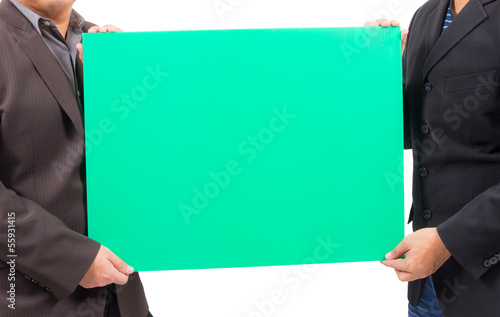 Photo: man holding blank green board man holding blank green board