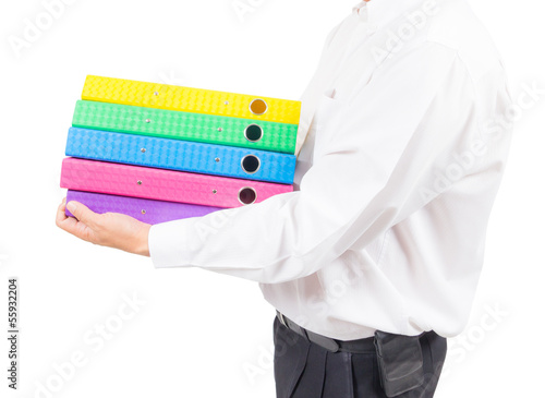 Photo: business man holding stack of colorful folder business man holding stack of colorful folder