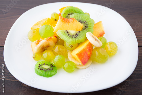 Photo: Assortment of sliced fruits on plate Assortment of sliced fruits on plate