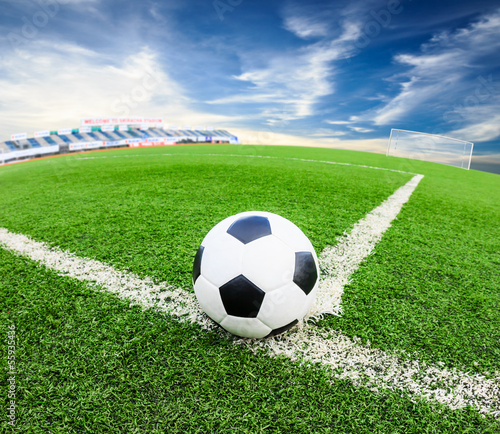 Photo: soccer ball on green grass field soccer ball on green grass field