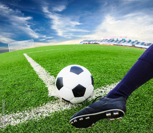 Photo: foot kicking soccer ball foot kicking soccer ball