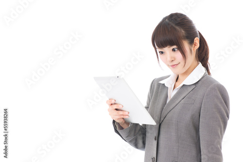 Photo: asian businesswoman using tablet computer asian businesswoman using tablet computer