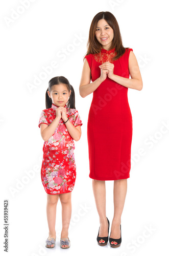 Photo: Full body Chinese parent and child greeting to each other Full body Chinese parent and child greeting to each other