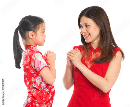 Photo: Chinese parent and child greeting to each other Chinese parent and child greeting to each other