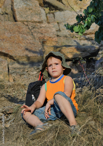 Photo: Educated little boy during a hiking expedition Educated little boy during a hiking expedition
