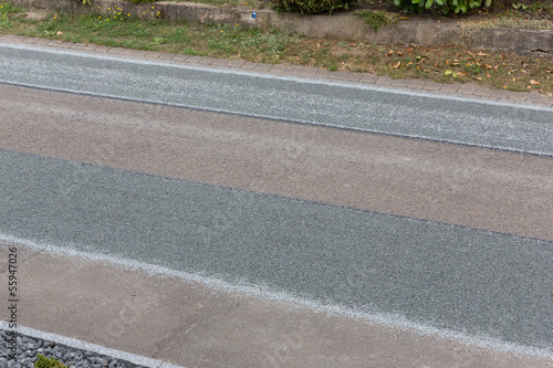Photo: Straßendecke mit Asphalt und Splitt Straßendecke mit Asphalt und Splitt