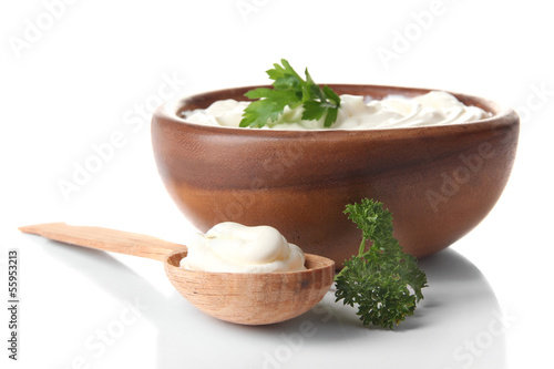 Photo: Sour cream in bowl isolated on white Sour cream in bowl isolated on white
