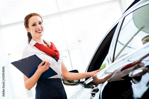 Photo: young woman in a showroom consultant young woman in a showroom consultant