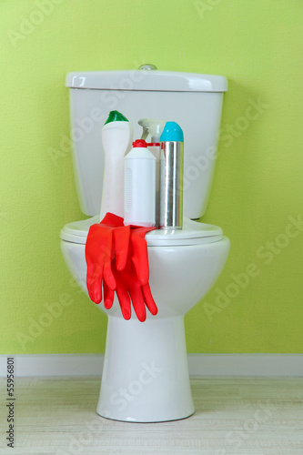 Photo: White toilet bowl and cleaner bottle in a bathroom White toilet bowl and cleaner bottle in a bathroom