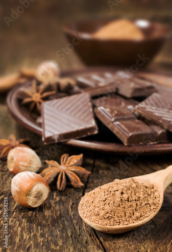 Photo: chocolate, nuts and cocoa powder close up chocolate, nuts and cocoa powder close up