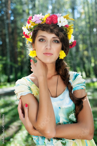 Photo: Attractive woman with flower wreath Attractive woman with flower wreath