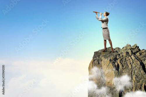 Photo: Business woman with telescope Business woman with telescope