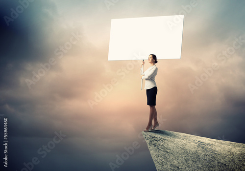 Photo: Business woman with banner Business woman with banner