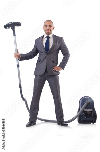 Photo: Businessman doing vacuum cleaning on white Businessman doing vacuum cleaning on white