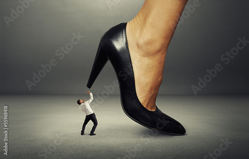 Photo: man under big female heel man under big female heel