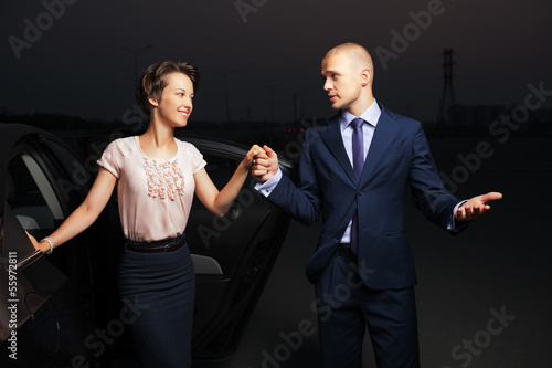 Photo: Young business couple at the car Young business couple at the car