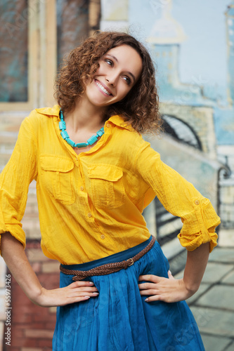 Photo: Happy young woman with curly hairs Happy young woman with curly hairs