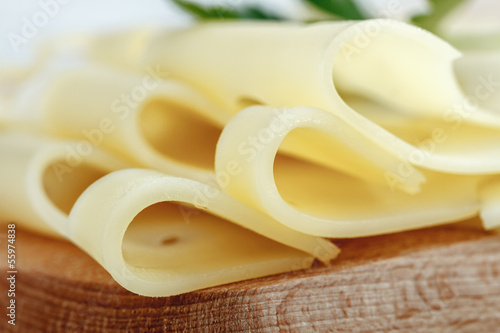 Photo: Slices of emmental cheese, closeup Slices of emmental cheese, closeup