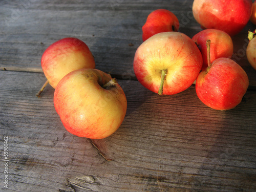 Photo: Red apples on a wooden surface Red apples on a wooden surface