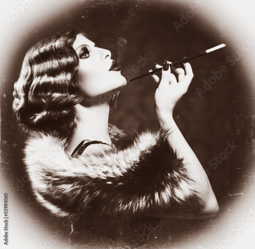Photo: Smoking Retro Woman. Vintage Styled Black and White Photo Smoking Retro Woman. Vintage Styled Black and White Photo