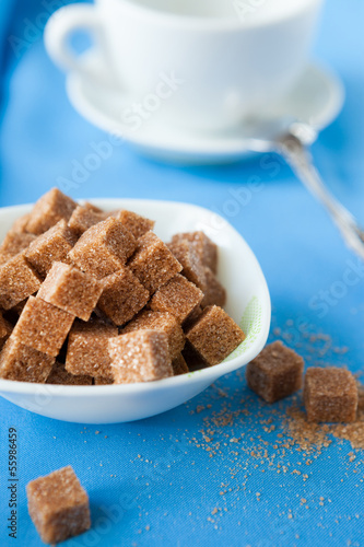 Photo: sugar cubes and white cup sugar cubes and white cup