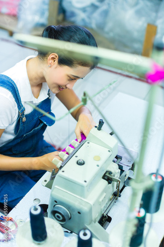 Photo: Indonesian seamstress in a textile factory Indonesian seamstress in a textile factory