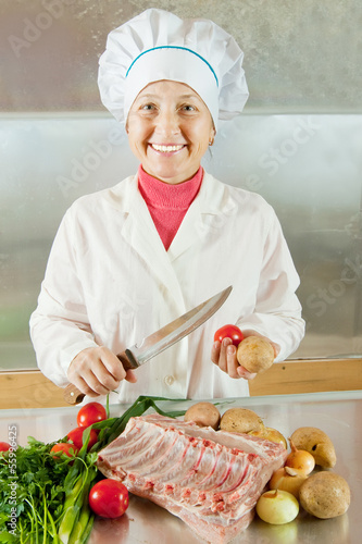 Photo: Cook with raw meat and vegetables Cook with raw meat and vegetables