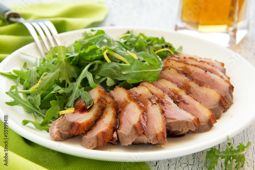 Photo: Salad with arugula and duck breast. Salad with arugula and duck breast.
