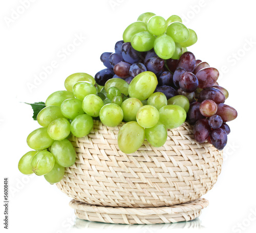 Photo: Ripe green and purple grapes in basket isolated on white Ripe green and purple grapes in basket isolated on white