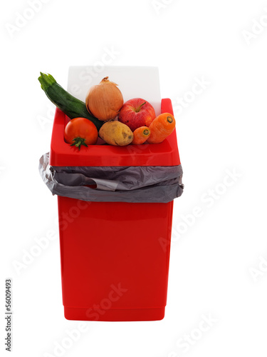 Photo: Good food wasted - slightly marked, imperfect vegetables in tras Good food wasted - slightly marked, imperfect vegetables in tras