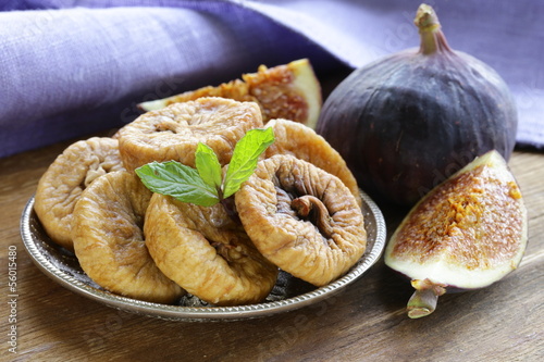 Photo: dried figs and fresh fruit on a wooden table dried figs and fresh fruit on a wooden table