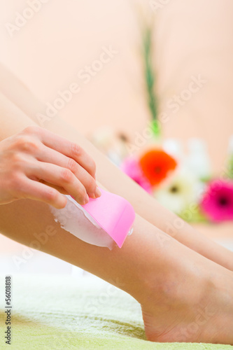 Photo: Woman in Spa getting a hair removal Woman in Spa getting a hair removal