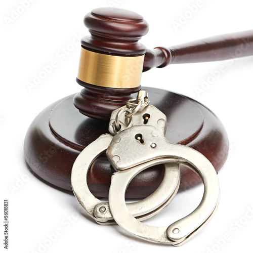 Photo: handcuffs and gavel handcuffs and gavel