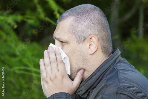 Photo: Man with a runny nose and napkin Man with a runny nose and napkin