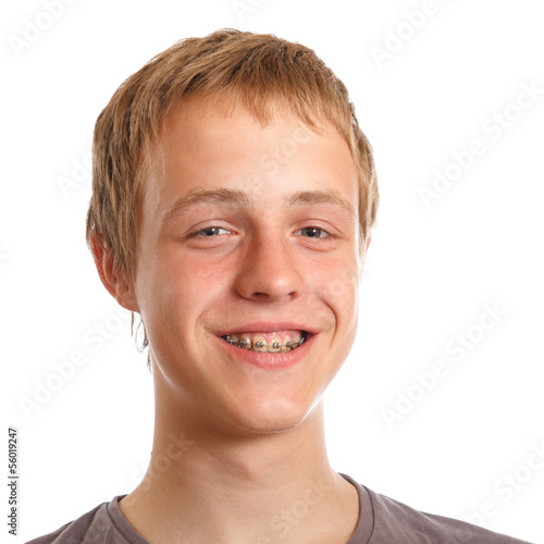 Photo: smiling teenager with dental braces smiling teenager with dental braces