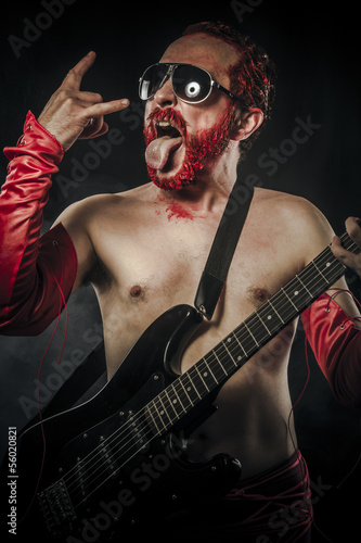 Photo: Heavy metal. Rock star playing solo on guitar Heavy metal. Rock star playing solo on guitar