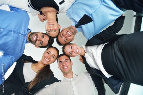 Photo: business people with their heads together business people with their heads together