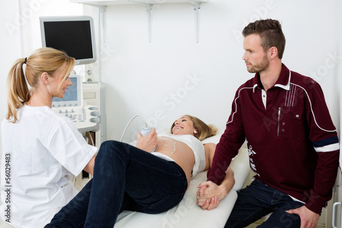 Photo: Doctor Performing Ultrasound Scan Doctor Performing Ultrasound Scan