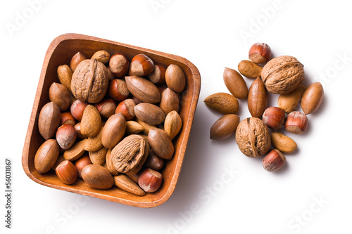 Photo: various unpeeled nuts in wooden bowl various unpeeled nuts in wooden bowl