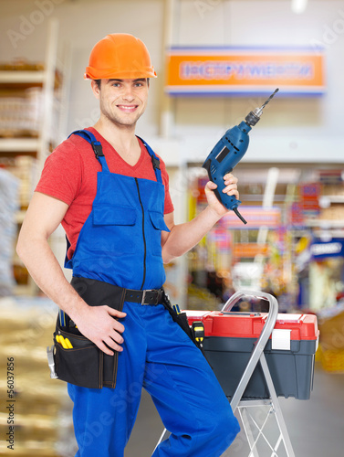 Photo: manual worker with tools at warehouse manual worker with tools at warehouse